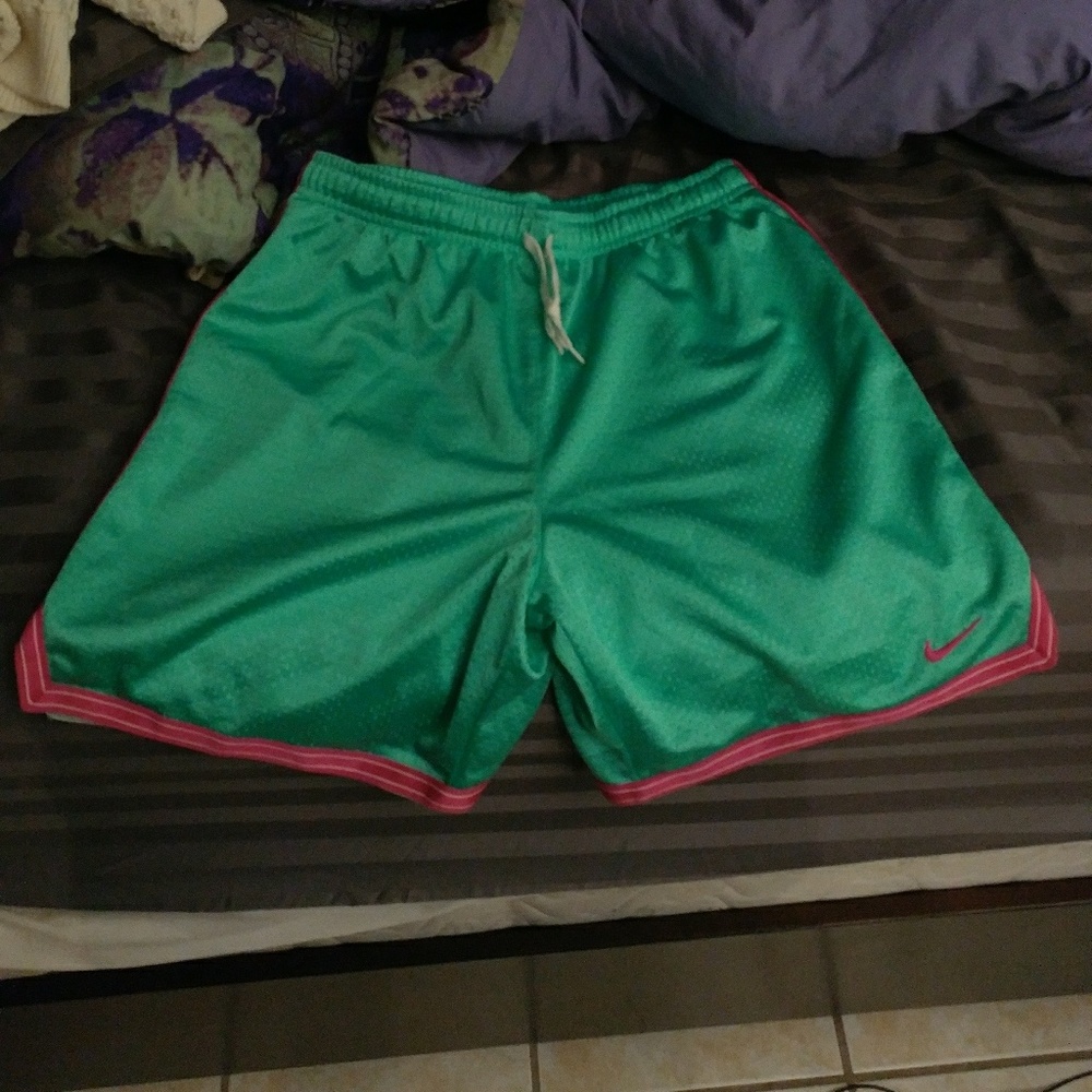 Nike teal and pink mesh shorts
